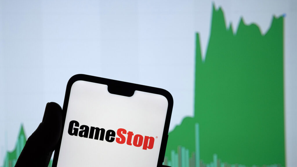 Smartphone with GameStop logo on screen