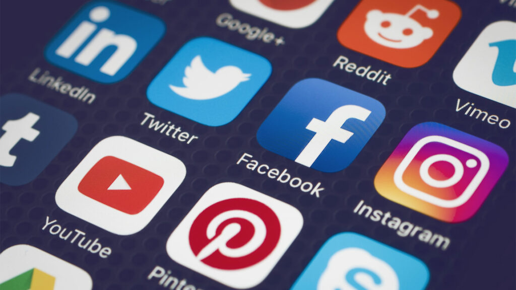 Smartphone showing app drawer with different social media icons