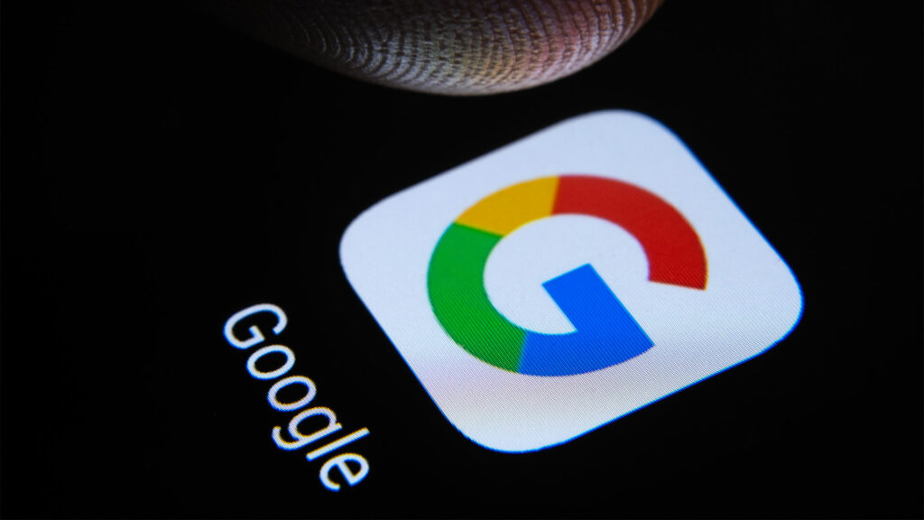 finger about to tap Google icon on smartphone