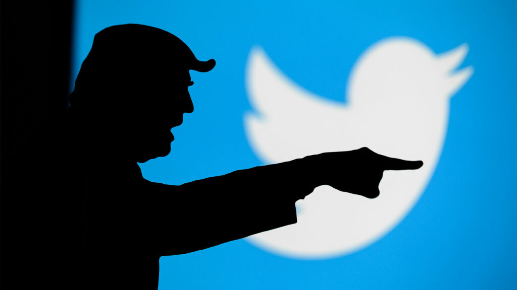 donald trump silhouette with Twitter logo in background