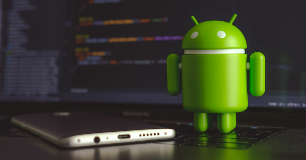 Android icon on laptop alongside smartphone