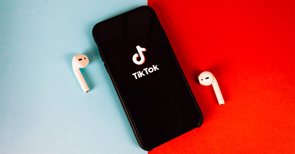 Smartphone with TikTok logo and colours on screen