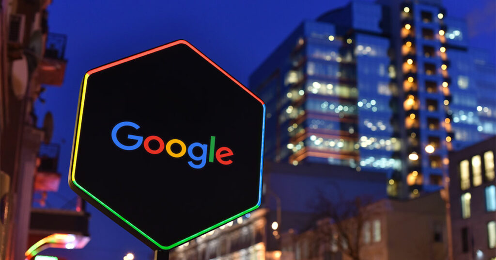 Background of the city with the Google logo on a road sign in Google colours