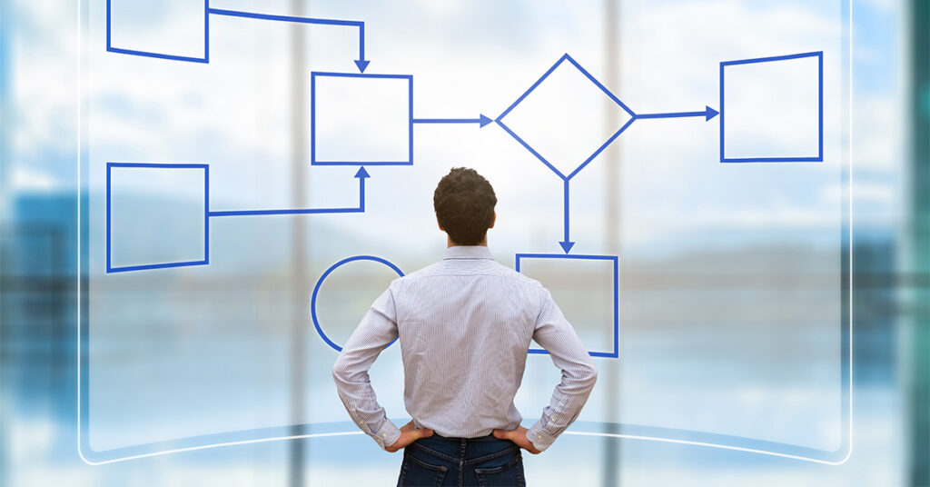 Man looking at Algorithm on board